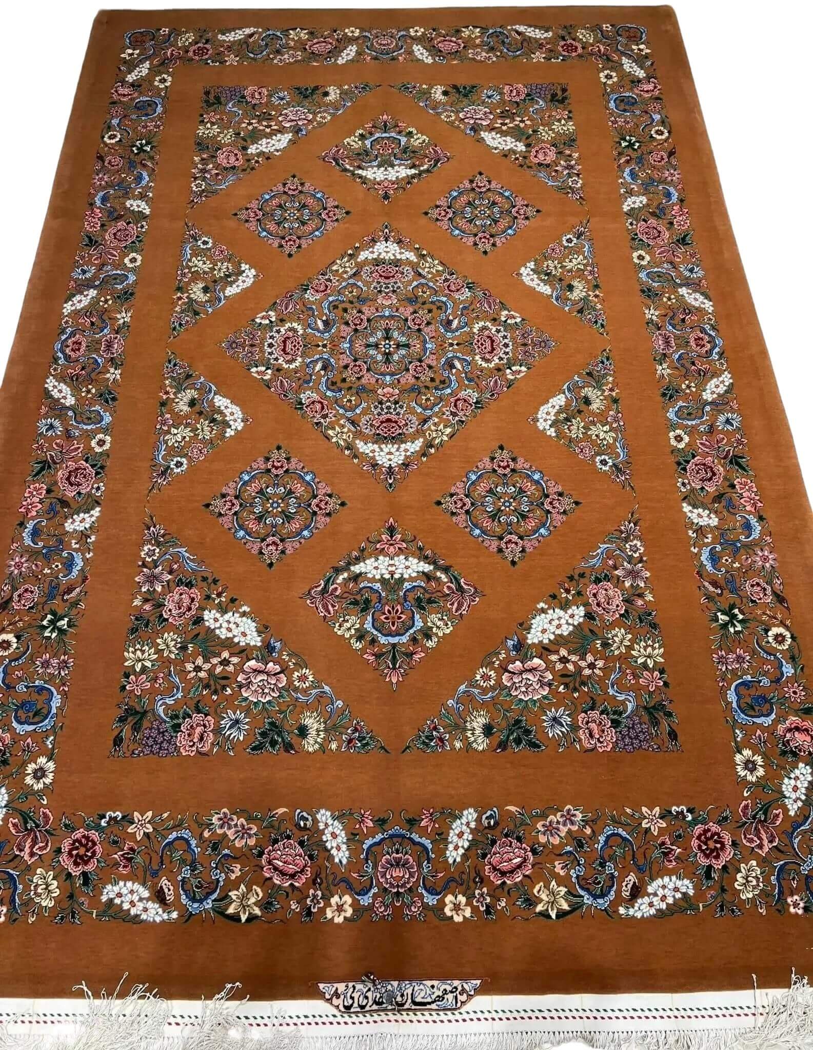 Hand-knotted Isfahan rug featuring a Kazak-inspired geometric design and floral border.